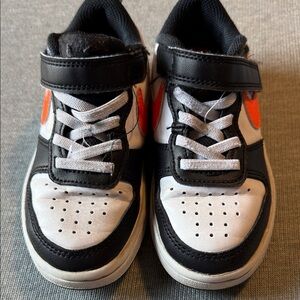 Nike Kids Black and White Sneakers with Orange Accents